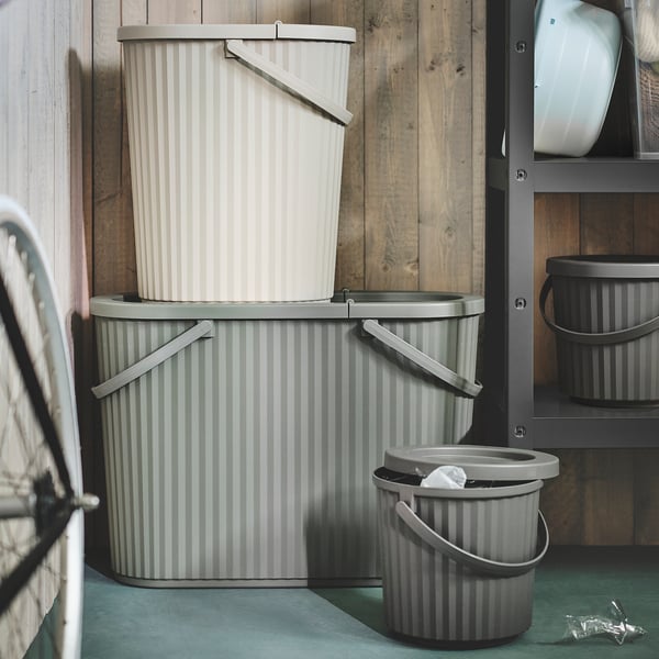 Three stacked DAMMÄNG bins: grey striped, showcasing size variation, perfect for waste sorting.