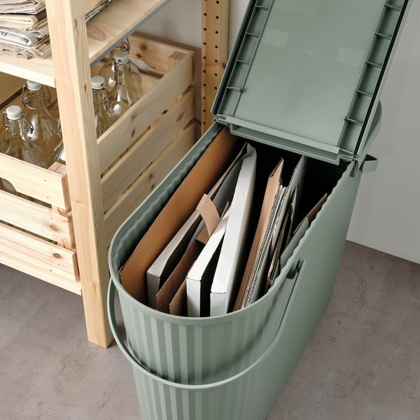 Green DAMMÄNG bin for large waste, stackable, removable lid, fits narrow spaces.