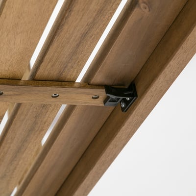 Close-up of a sturdy, wooden folding tables hinge mechanism, showcasing quality craftsmanship.