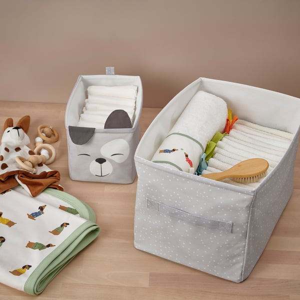 Baby storage with blankets, towels, toys, dogs