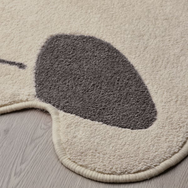 Circular plush rug with soft grey and white fleece, high quality, designed for comfort.