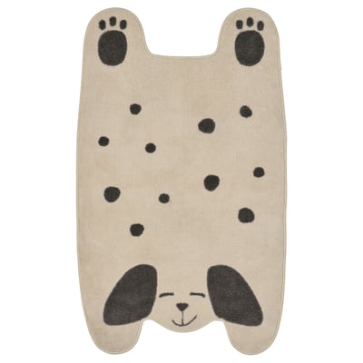 Cute tan puppy-shaped rug with black spots, paws, and eyes; soft, recycled polyester.