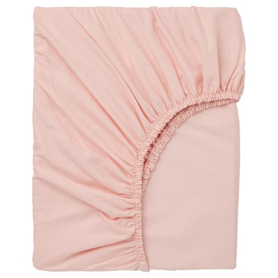 Light pink DVALA fitted sheet, soft cotton, rounded corners, ruched elastic edges.