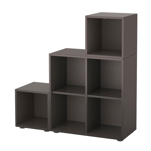 Dark grey EKET storage cubes in asymmetrical, modern design with multiple open compartments.