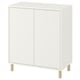 White EKET cabinet with 2 doors and light wood legs.