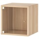 Light oak-colored, square storage cabinet with glass door.