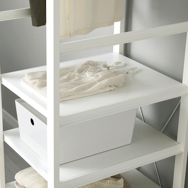 White shelf unit with fabric items. Cross-brace for stability.