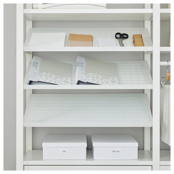 White shelving unit with adjustable compartments, holding file trays and storage boxes, designed for organizing office supplies.