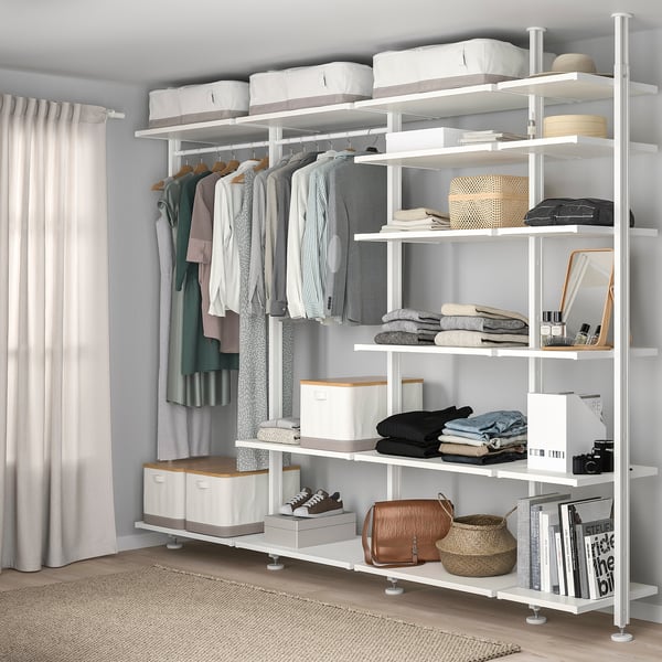 ELVARLI white storage system organises clothes and items on adjustable shelves.