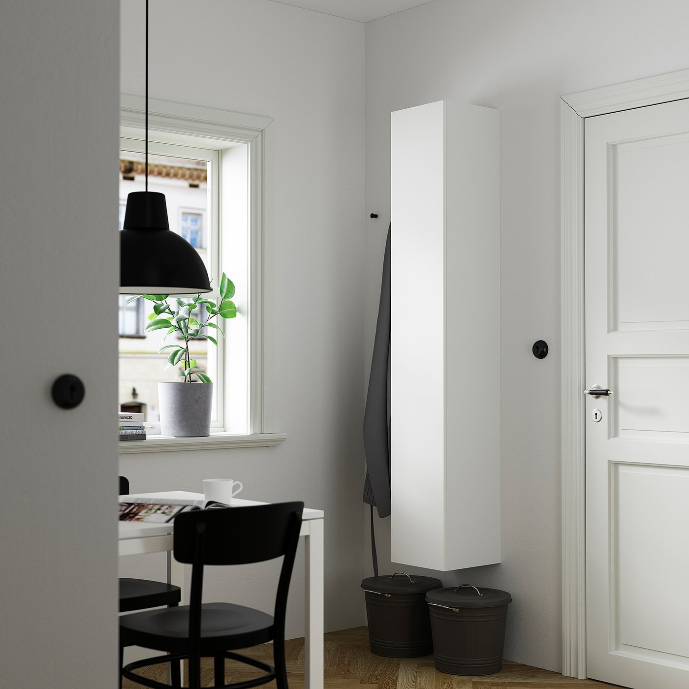 Modern space-saving white ENHET cabinet with black accents offers ample storage.