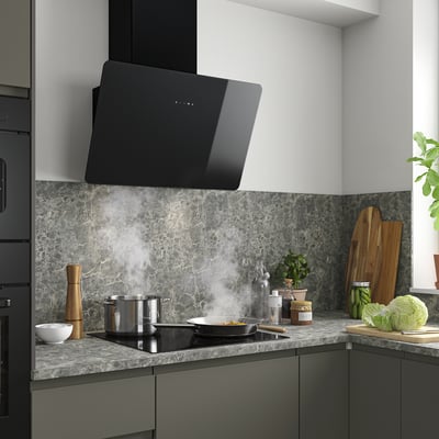 Modern kitchen with FINSMAKARE hood, glass, led, steel cooktop, marble counter, items, wooden boards.