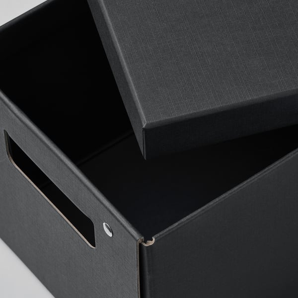Black storage box with lid partially open, handles and crafted edges showing high quality design.