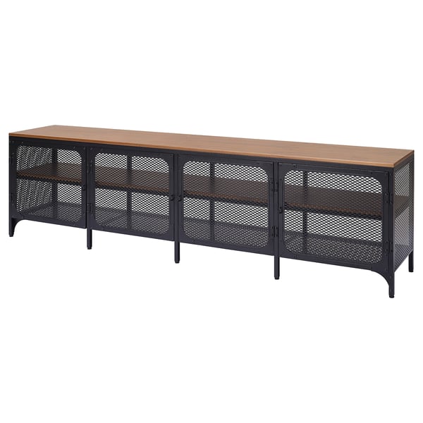 A black and wood FJÄLLBO tv bench with an industrial metal and solid wood design. It multiple shelves for storage and adjustable feet for stability.