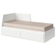 A white FLEKKE day-bed with beige cushions, minimalist design, large storage, and adjustable backrest.