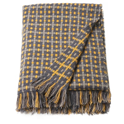 A grey and yellow woven throw blanket with fringes.