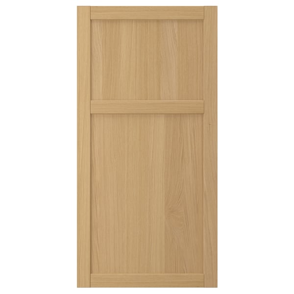 A FORSBACKA wooden cabinet door in natural oak with a classic frame design.