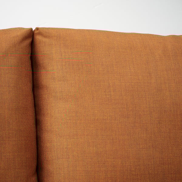 Close-up of FRIHETEN sofas sturdy, textured fabric, showcasing its quality and comfort.
