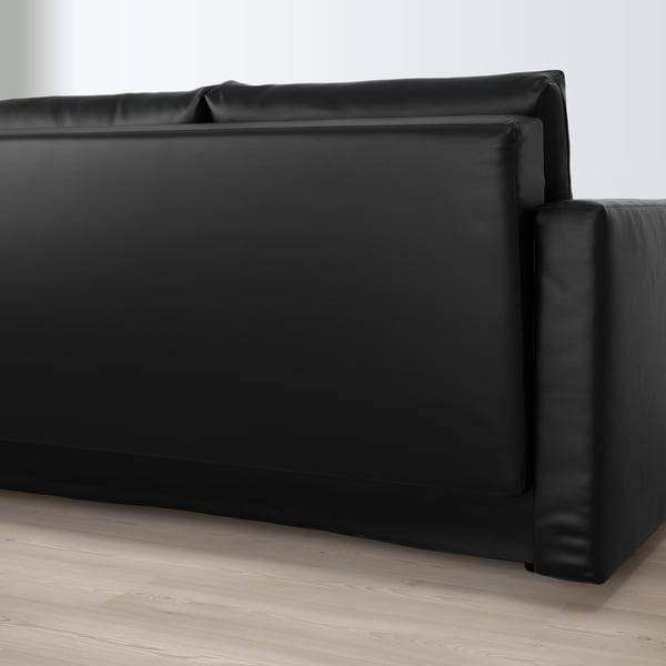Black convertible sofa with storage, shown from side.