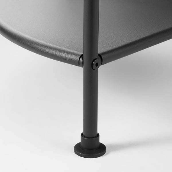 Black metal table leg with adjustable foot; sturdy, stable, and easy to clean.