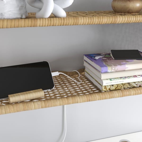 Shelves with books, tablet, and decor. Includes rattan wall shelf with cable management slot.
