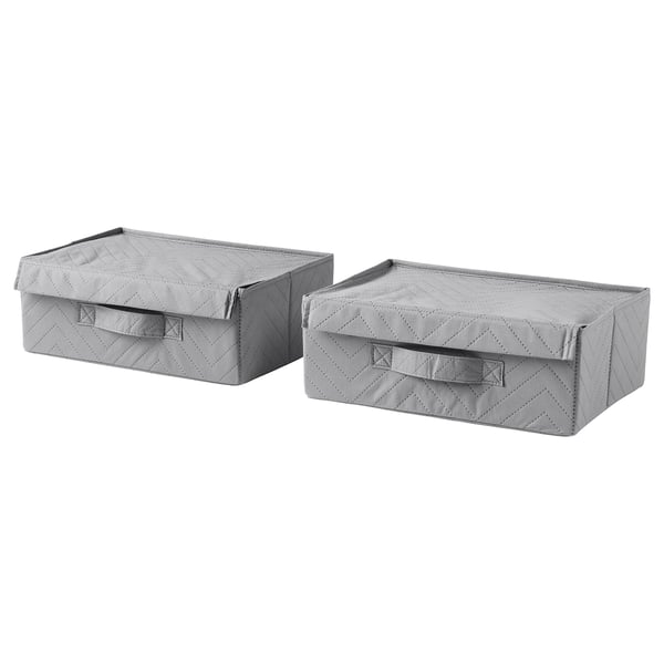 Two light grey fabric storage boxes with handles, rectangular and lid-covered, likely for organising items.