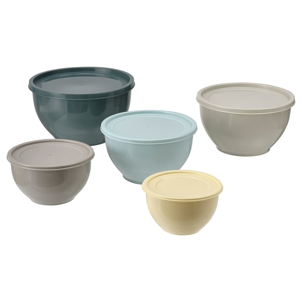 Five nesting mixing bowls in various colours: blue, light blue, beige, white, and cream; made from plastic; designed for storing food.