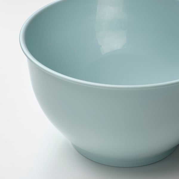 Light blue plastic bowl, smooth surface, glossy finish, good quality.