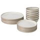 A stack of GLADELIG sandy-colored plates and bowls, made of stoneware, with a classic and decorative design.