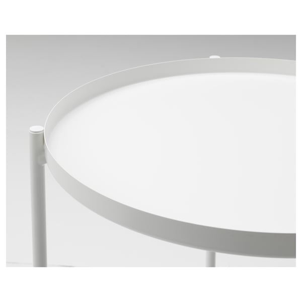 Round metal table with curved edge, tray top, and white supports. Modern, durable, and easy to clean.