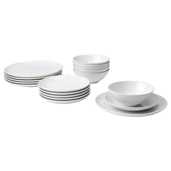 Stacks of white plates and bowls. Simple, modern design. Glazed stoneware material. Suitable for everyday use and parties.