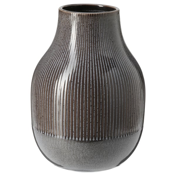Black stoneware vase with vertical lines. Rounded body, narrower neck, unique glaze.