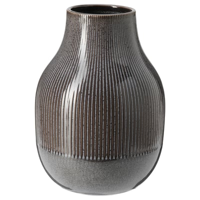 Black stoneware vase with vertical lines. Rounded body, narrower neck, unique glaze.