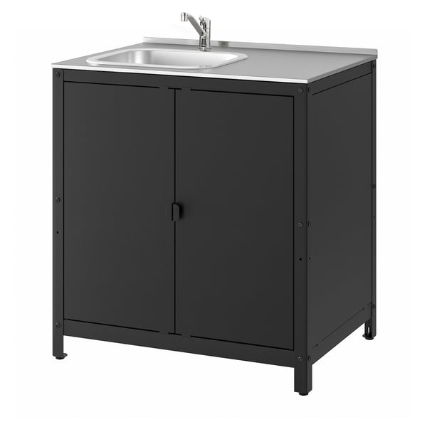 The GRILLSKÄR outdoor sink, black in colour with a stainless steel top, double doors for storage, and a sleek, modern design.