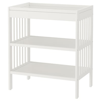 A white ikea GULLIVER changing table with two shelves, made of fibreboard and solid wood, designed for baby changing.