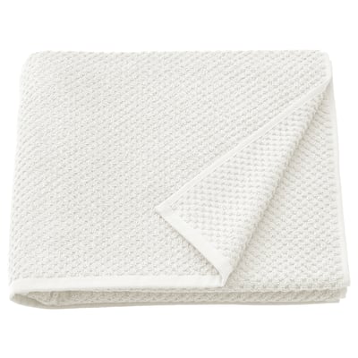 Folded beige GULVIAL towel, textured cotton.