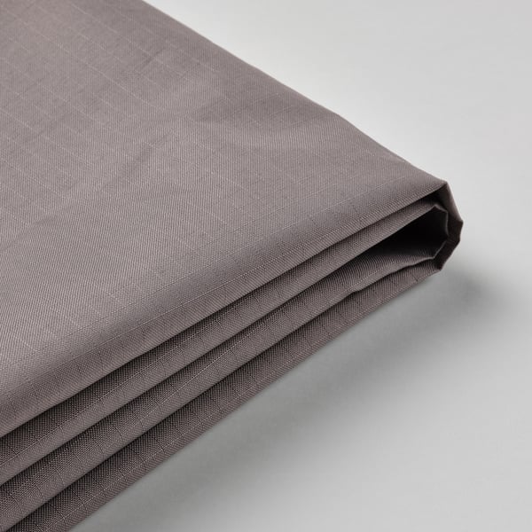 Close-up of folded grey fabric, smooth texture, neatly pressed.