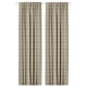 Two beige HÄGGVECKMAL curtains with tartan pattern, room-darkening, wool-like texture, hanging straight.