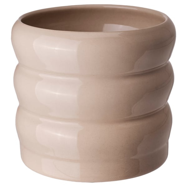 Beige, ribbed ceramic planter with unique glaze variations.