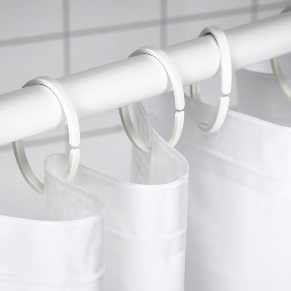 White shower curtain rod with multiple hooks holding a white shower curtain.