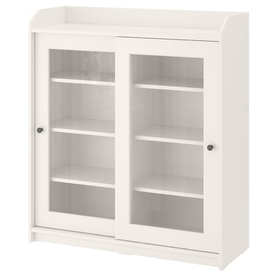 This image displays a white HAUGA cabinet with glass doors, ideal for displaying items. It has a classic design with a top shelf and sliding doors.