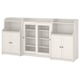 Three-piece white HAUGA storage set; mix of open and closed shelves, glass doors on central unit.