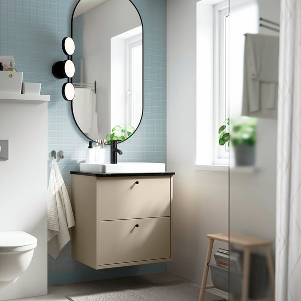 Beige vanity, semi-recessed sink, round mirror, compact design.
