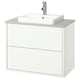 White HAVBÄCK bathroom vanity, modern design with drawers, sleek countertop, and chrome tap.