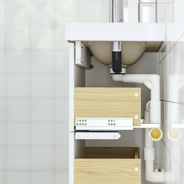 HAVBÄCK bathroom cabinet shown with full drawers, wall-mounted, and white piping.