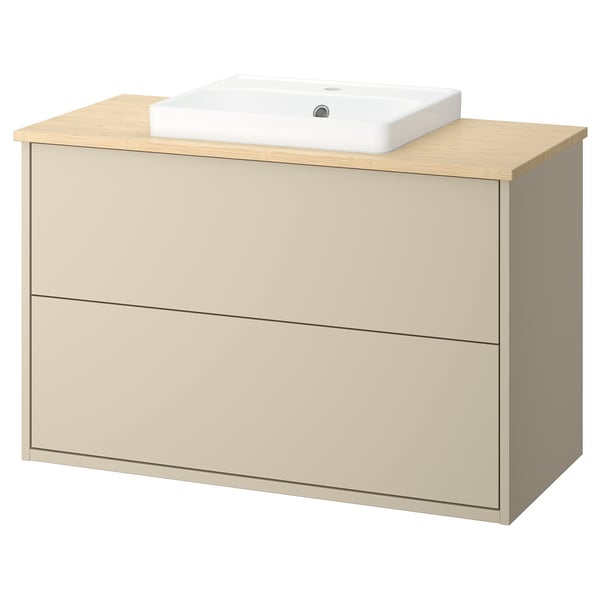 Beige wooden bathroom vanity with bamboo countertop and ceramic basin.
