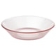 A pink-tinted, clear glass bowl named HAVSGÄDDA with ridged lines, designed for serving food or desserts.