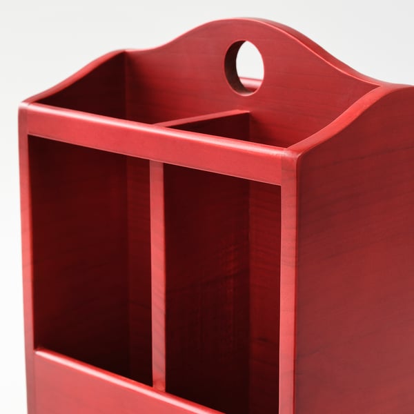 Red wooden knife block with curved top; sturdy, durable; holds multiple knives and kitchen tools.