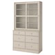 A beige HAVSTA furniture unit with six drawers and glass doors, combining rustic pine and modern design.