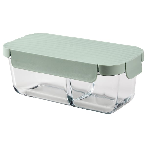 A HAVSTOBIS glass lunch box with a green lid and divider. Its rectangular and designed for storing food separately.