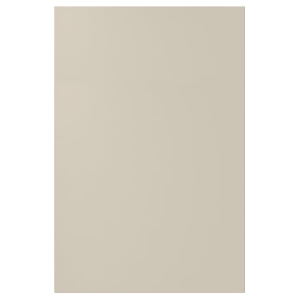 A beige HAVSTORP kitchen cabinet door. It has smooth panels and a modern design, crafted from acrylic paint and fiberboard.